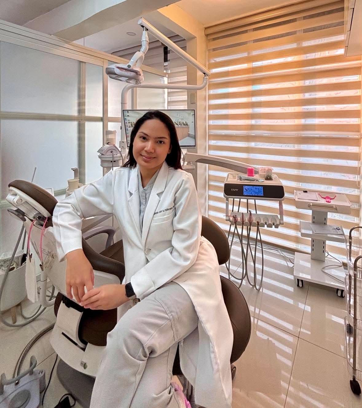 Dr. Aerish Joy D. Peñones seated inside The A+ Dental Clinic